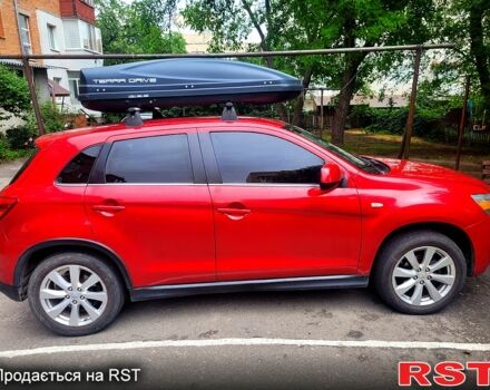 Красный Мицубиси Outlander Sport, объемом двигателя 2 л и пробегом 220 тыс. км за 11300 $, фото 5 на Automoto.ua