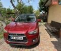 Красный Мицубиси Outlander Sport, объемом двигателя 2 л и пробегом 172 тыс. км за 12500 $, фото 4 на Automoto.ua