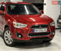Красный Мицубиси Outlander Sport, объемом двигателя 2 л и пробегом 99 тыс. км за 11999 $, фото 1 на Automoto.ua