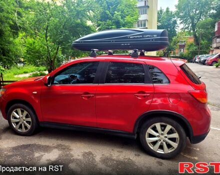 Красный Мицубиси Outlander Sport, объемом двигателя 2 л и пробегом 220 тыс. км за 11300 $, фото 4 на Automoto.ua