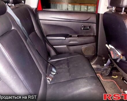 Красный Мицубиси Outlander Sport, объемом двигателя 2 л и пробегом 220 тыс. км за 11300 $, фото 2 на Automoto.ua