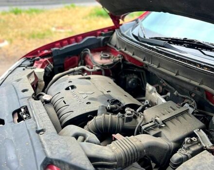 Красный Мицубиси Outlander Sport, объемом двигателя 2 л и пробегом 174 тыс. км за 10700 $, фото 7 на Automoto.ua