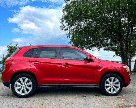 Красный Мицубиси Outlander Sport, объемом двигателя 2 л и пробегом 174 тыс. км за 10700 $, фото 1 на Automoto.ua
