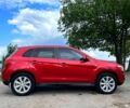 Красный Мицубиси Outlander Sport, объемом двигателя 2 л и пробегом 174 тыс. км за 10700 $, фото 1 на Automoto.ua