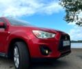 Красный Мицубиси Outlander Sport, объемом двигателя 2 л и пробегом 174 тыс. км за 10700 $, фото 4 на Automoto.ua