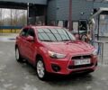 Красный Мицубиси Outlander Sport, объемом двигателя 2 л и пробегом 220 тыс. км за 11500 $, фото 1 на Automoto.ua