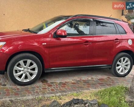 Красный Мицубиси Outlander Sport, объемом двигателя 2 л и пробегом 172 тыс. км за 12500 $, фото 1 на Automoto.ua