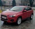 Красный Мицубиси Outlander Sport, объемом двигателя 2 л и пробегом 220 тыс. км за 11500 $, фото 1 на Automoto.ua
