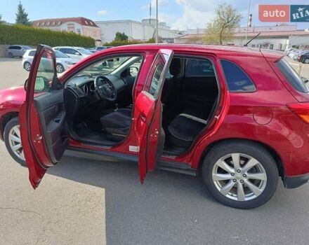 Красный Мицубиси Outlander Sport, объемом двигателя 2 л и пробегом 220 тыс. км за 11500 $, фото 4 на Automoto.ua