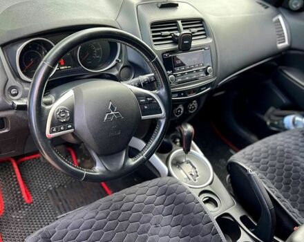 Красный Мицубиси Outlander Sport, объемом двигателя 2 л и пробегом 174 тыс. км за 10700 $, фото 8 на Automoto.ua
