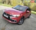 Красный Мицубиси Outlander Sport, объемом двигателя 2.4 л и пробегом 185 тыс. км за 12299 $, фото 1 на Automoto.ua