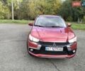 Красный Мицубиси Outlander Sport, объемом двигателя 2.4 л и пробегом 185 тыс. км за 12299 $, фото 3 на Automoto.ua