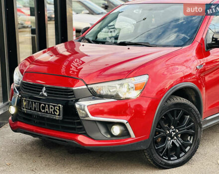 Красный Мицубиси Outlander Sport, объемом двигателя 2 л и пробегом 127 тыс. км за 12499 $, фото 1 на Automoto.ua