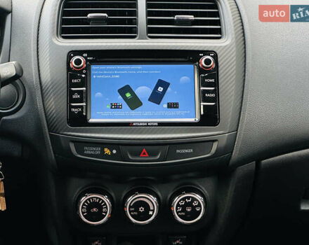 Красный Мицубиси Outlander Sport, объемом двигателя 2 л и пробегом 127 тыс. км за 12499 $, фото 30 на Automoto.ua