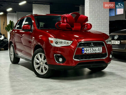 Красный Мицубиси Outlander Sport, объемом двигателя 2 л и пробегом 99 тыс. км за 11999 $, фото 1 на Automoto.ua