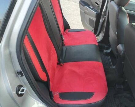 Серый Мицубиси Outlander Sport, объемом двигателя 2 л и пробегом 189 тыс. км за 11200 $, фото 10 на Automoto.ua