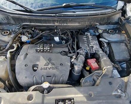 Серый Мицубиси Outlander Sport, объемом двигателя 2 л и пробегом 158 тыс. км за 11850 $, фото 28 на Automoto.ua