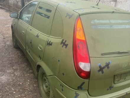 Синій Ніссан Альмера Тіна, об'ємом двигуна 2.2 л та пробігом 250 тис. км за 1000 $, фото 1 на Automoto.ua