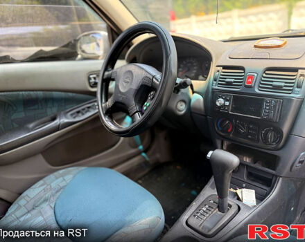 Білий Ніссан Альмера, об'ємом двигуна 1.8 л та пробігом 198 тис. км за 2500 $, фото 6 на Automoto.ua