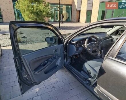 Черный Ниссан Альмера, объемом двигателя 1.5 л и пробегом 269 тыс. км за 2550 $, фото 9 на Automoto.ua