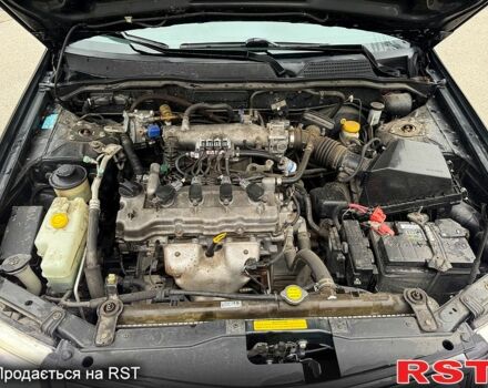 Чорний Ніссан Альмера, об'ємом двигуна 1.6 л та пробігом 245 тис. км за 4600 $, фото 11 на Automoto.ua