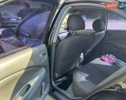 Черный Ниссан Альмера, объемом двигателя 1.6 л и пробегом 241 тыс. км за 3500 $, фото 4 на Automoto.ua