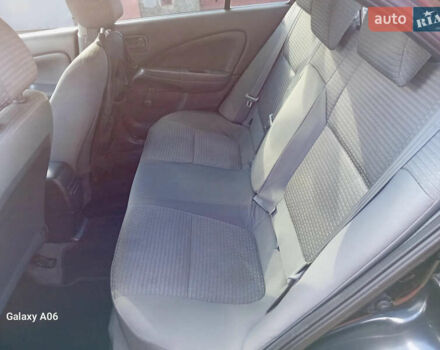 Черный Ниссан Альмера, объемом двигателя 1.6 л и пробегом 185 тыс. км за 4500 $, фото 65 на Automoto.ua