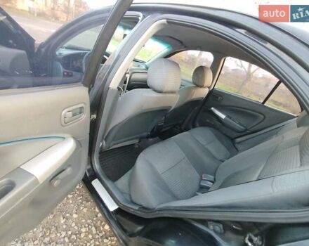 Черный Ниссан Альмера, объемом двигателя 1.6 л и пробегом 244 тыс. км за 4500 $, фото 47 на Automoto.ua