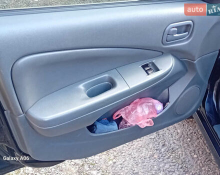 Черный Ниссан Альмера, объемом двигателя 1.6 л и пробегом 185 тыс. км за 4500 $, фото 48 на Automoto.ua