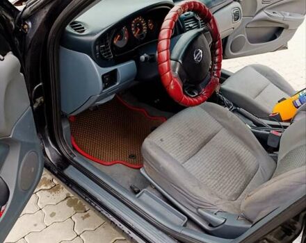 Черный Ниссан Альмера, объемом двигателя 1.6 л и пробегом 224 тыс. км за 3300 $, фото 2 на Automoto.ua