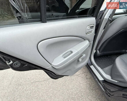 Черный Ниссан Альмера, объемом двигателя 1.6 л и пробегом 123 тыс. км за 6499 $, фото 13 на Automoto.ua