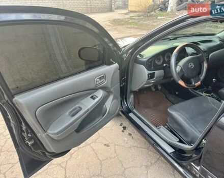 Чорний Ніссан Альмера, об'ємом двигуна 1.6 л та пробігом 140 тис. км за 5900 $, фото 11 на Automoto.ua