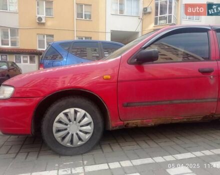 Красный Ниссан Альмера, объемом двигателя 1.39 л и пробегом 332 тыс. км за 1300 $, фото 11 на Automoto.ua