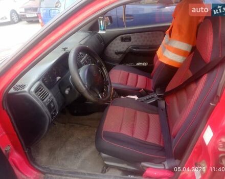 Красный Ниссан Альмера, объемом двигателя 1.39 л и пробегом 332 тыс. км за 1300 $, фото 5 на Automoto.ua