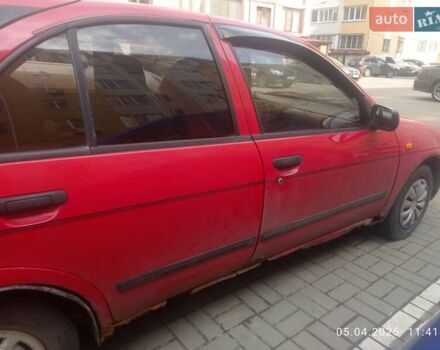 Красный Ниссан Альмера, объемом двигателя 1.39 л и пробегом 332 тыс. км за 1300 $, фото 7 на Automoto.ua