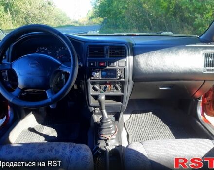 Червоний Ніссан Альмера, об'ємом двигуна 1.4 л та пробігом 250 тис. км за 2200 $, фото 9 на Automoto.ua