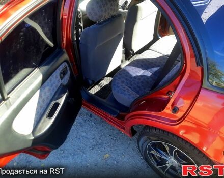 Червоний Ніссан Альмера, об'ємом двигуна 1.4 л та пробігом 250 тис. км за 2200 $, фото 8 на Automoto.ua