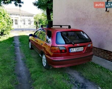 Красный Ниссан Альмера, объемом двигателя 1.4 л и пробегом 280 тыс. км за 2000 $, фото 1 на Automoto.ua