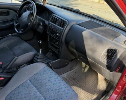 Червоний Ніссан Альмера, об'ємом двигуна 1.4 л та пробігом 293 тис. км за 1200 $, фото 6 на Automoto.ua