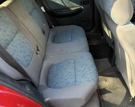 Червоний Ніссан Альмера, об'ємом двигуна 1.4 л та пробігом 293 тис. км за 1200 $, фото 7 на Automoto.ua