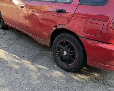 Червоний Ніссан Альмера, об'ємом двигуна 1.4 л та пробігом 293 тис. км за 1200 $, фото 4 на Automoto.ua