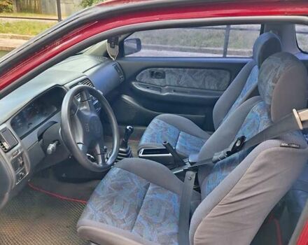 Красный Ниссан Альмера, объемом двигателя 1.39 л и пробегом 225 тыс. км за 2250 $, фото 1 на Automoto.ua