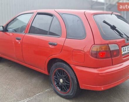 Красный Ниссан Альмера, объемом двигателя 1.39 л и пробегом 29 тыс. км за 2250 $, фото 4 на Automoto.ua