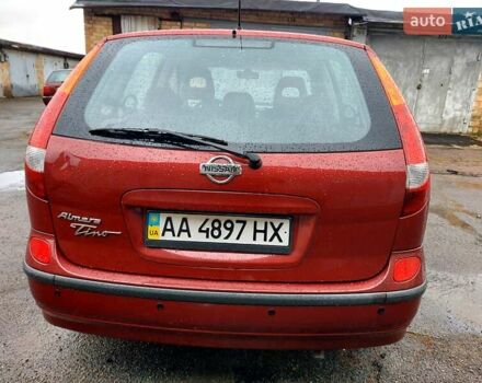 Красный Ниссан Альмера, объемом двигателя 2 л и пробегом 170 тыс. км за 3500 $, фото 4 на Automoto.ua