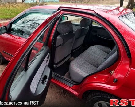 Красный Ниссан Альмера, объемом двигателя 1.4 л и пробегом 174 тыс. км за 2300 $, фото 8 на Automoto.ua