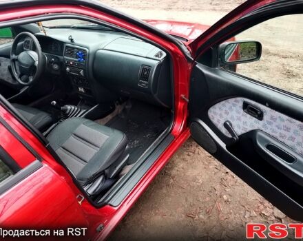 Красный Ниссан Альмера, объемом двигателя 1.4 л и пробегом 174 тыс. км за 2300 $, фото 7 на Automoto.ua