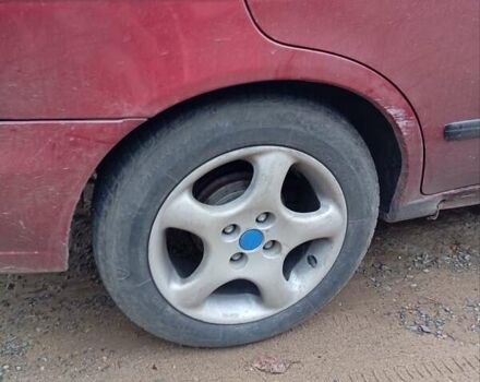 Красный Ниссан Альмера, объемом двигателя 1.4 л и пробегом 300 тыс. км за 1100 $, фото 5 на Automoto.ua