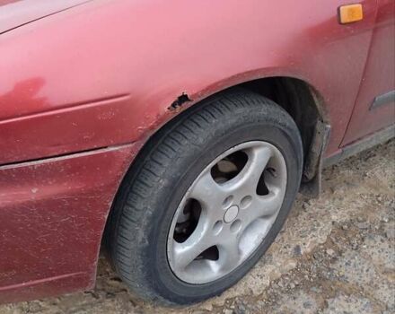 Красный Ниссан Альмера, объемом двигателя 1.4 л и пробегом 300 тыс. км за 1100 $, фото 13 на Automoto.ua