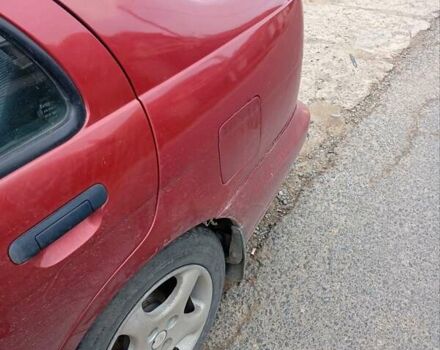 Красный Ниссан Альмера, объемом двигателя 1.4 л и пробегом 300 тыс. км за 1100 $, фото 8 на Automoto.ua