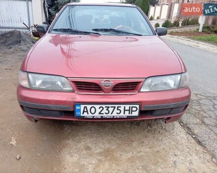 Красный Ниссан Альмера, объемом двигателя 1.4 л и пробегом 300 тыс. км за 1100 $, фото 17 на Automoto.ua